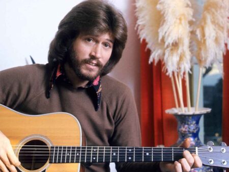 Barry Gibb playing guitar
