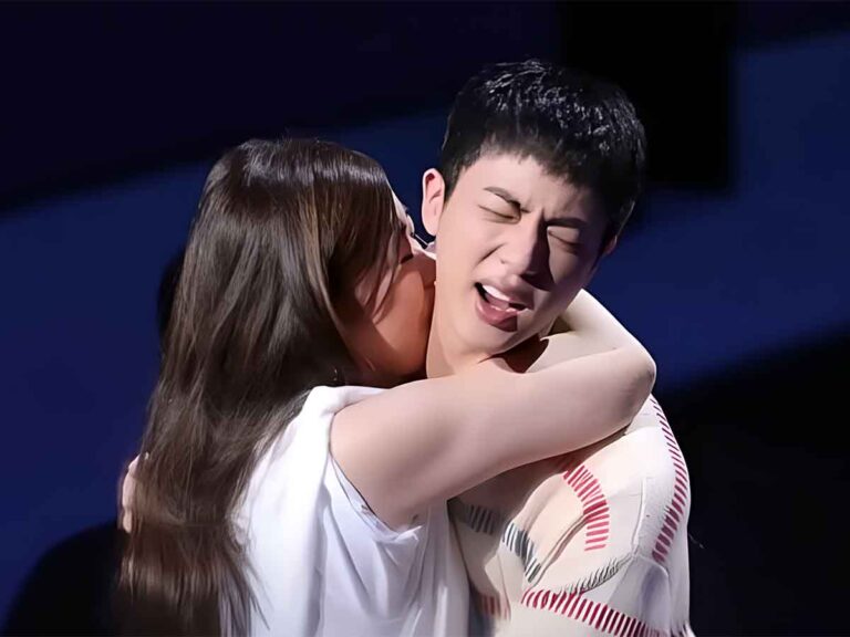 Jin from BTS getting kissed