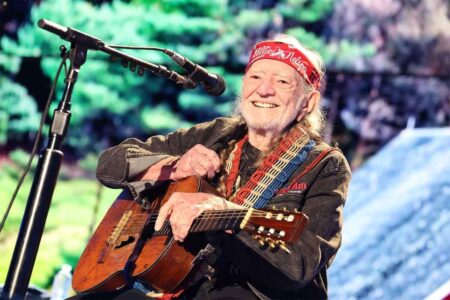 Willie Nelson with his guitar