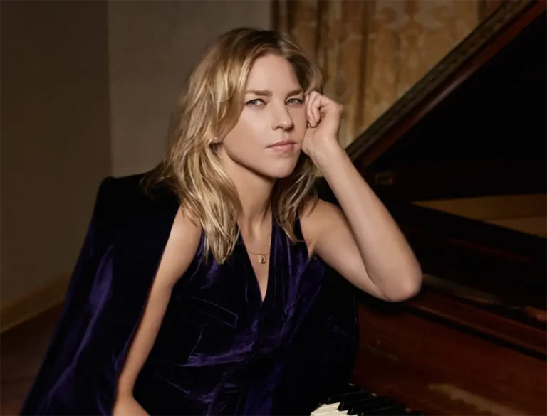 Diana Krall with her elbow on a piano