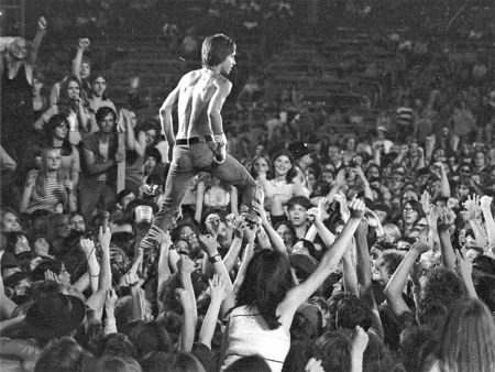 A man in a 1970s rock concert