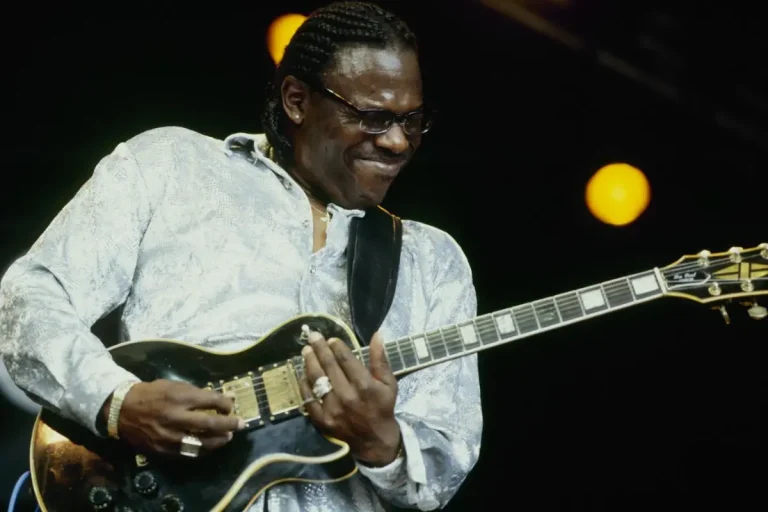 Buddy Guy playing electric guitar on stage