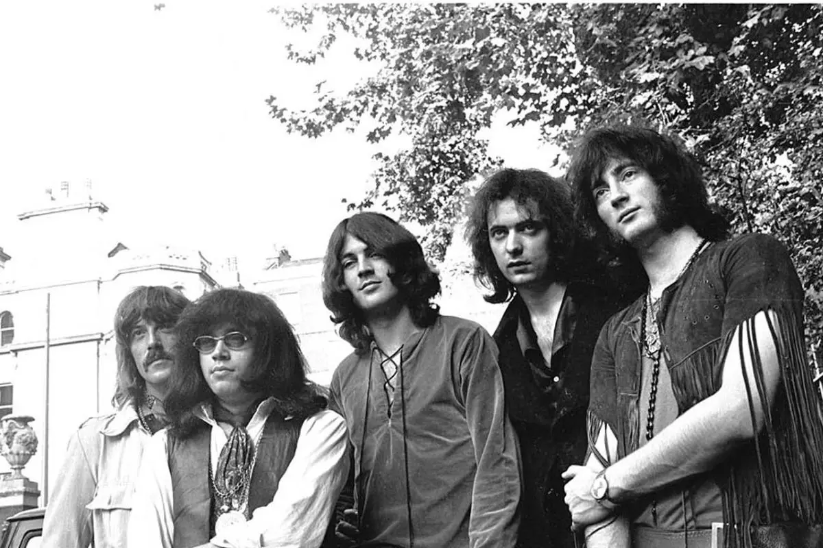 Deep Purple lineup posing outdoors, wearing 1960s rock fashion in a black-and-white portrait.