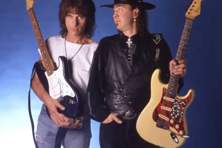 Jeff Beck on Hendrix and Stevie Ray Vaughan: The Day Guitar Gods Got Scared Jeff Beck and Stevie Ray Vaughan stand side by side holding their electric guitars, Jeff Beck looking directly at the camera while Stevie Ray glances toward him.