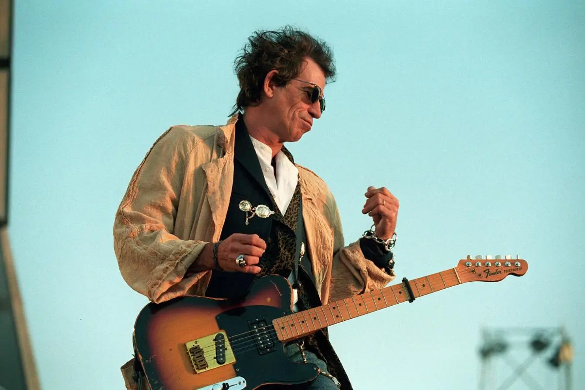 Keith Richards performing live outdoors with a Fender Telecaster.