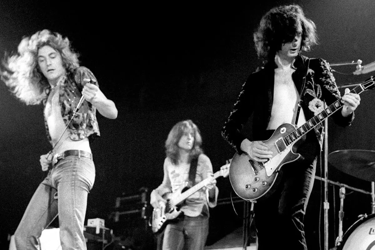 Led Zeppelin performing “Black Dog” era together with 2 band members.