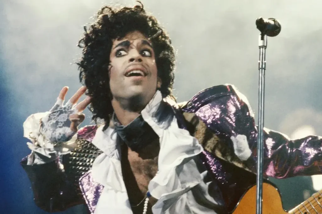 Prince’s Purple Rain Oscar Moment: The Award He Barely Wanted (But Changed Music Movies) Prince performing live in a purple stage outfit.