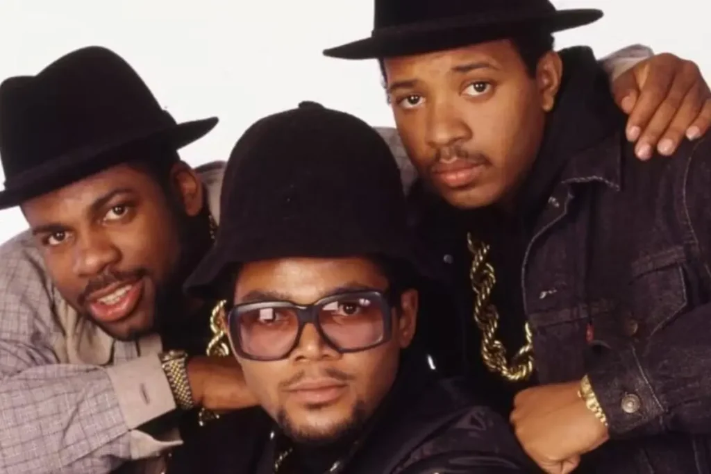 Run‑D.M.C.’s ‘Raising Hell’: The Rap Album That Crashed Rock’s Party Run-DMC pose closely together for a studio portrait.