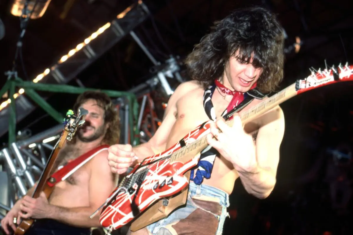 Van Halen performs shirtless onstage.