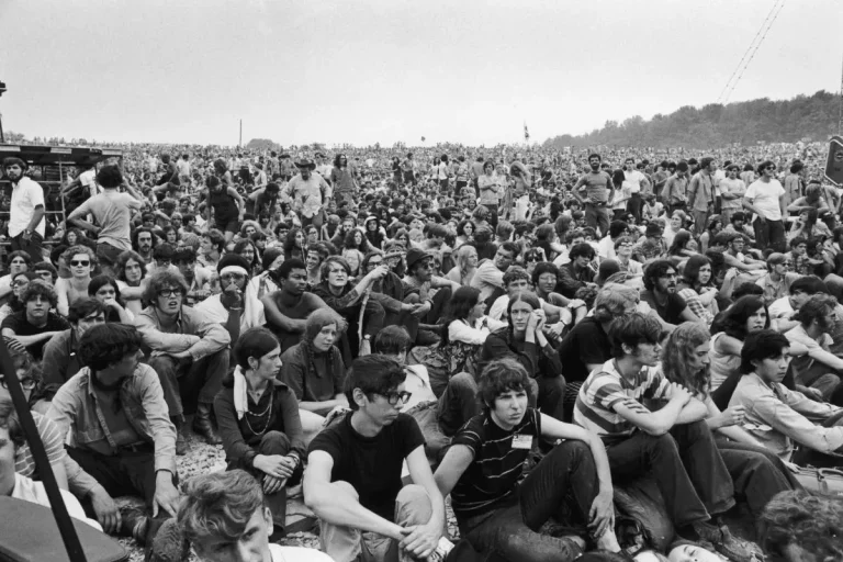 Massive crowd seated on the ground at the Woodstock Music Festival, 1969.