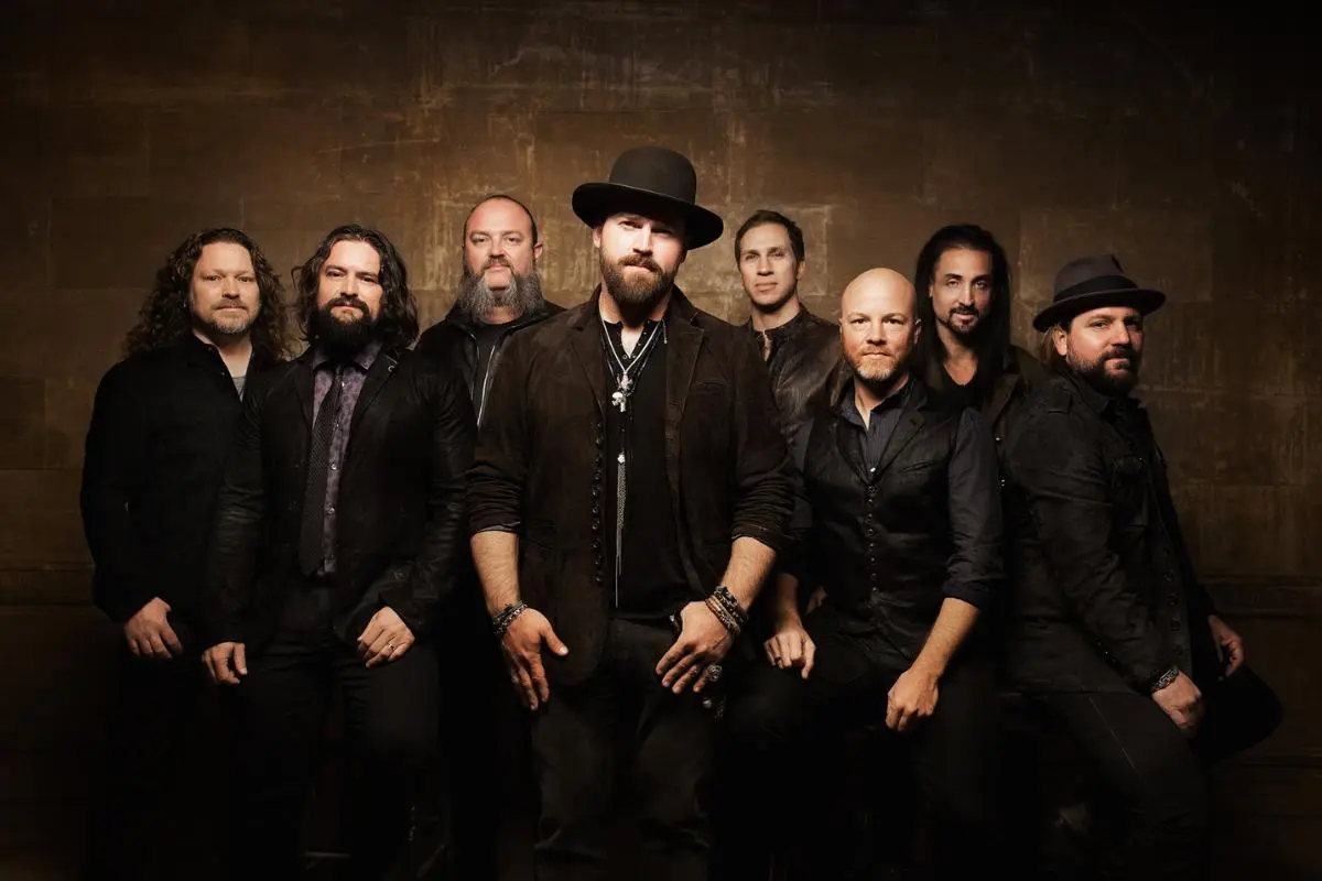 Zac Brown Band posing together in a studio-style group portrait.