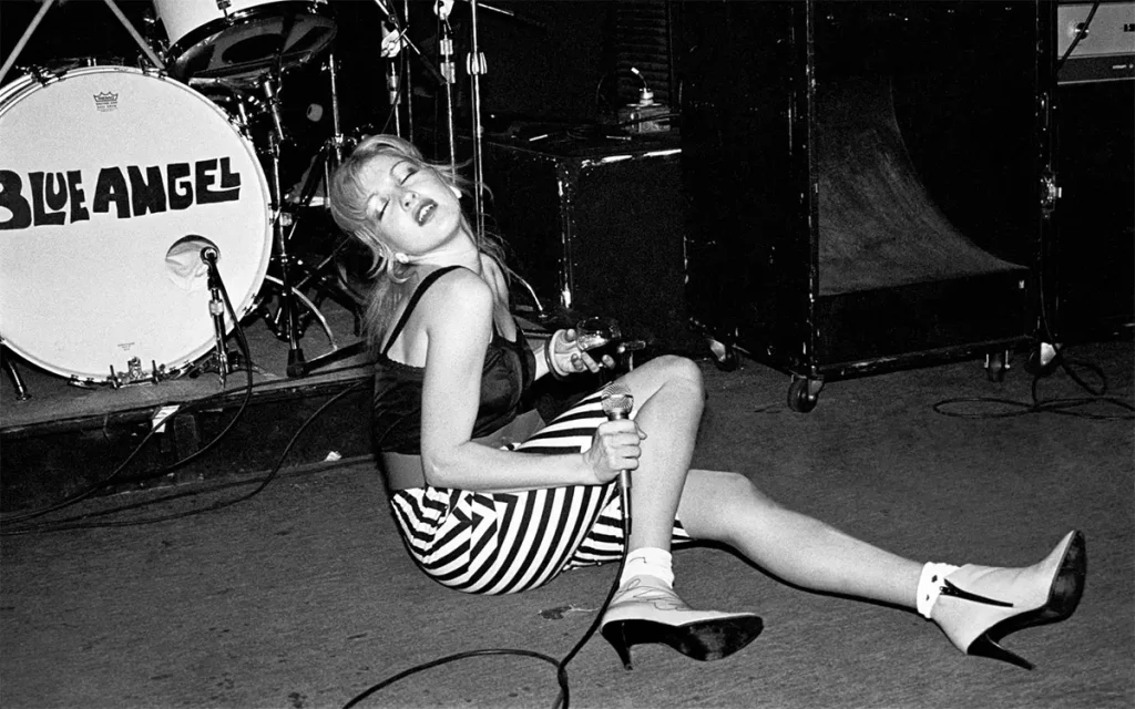 Cyndi Lauper sitting down