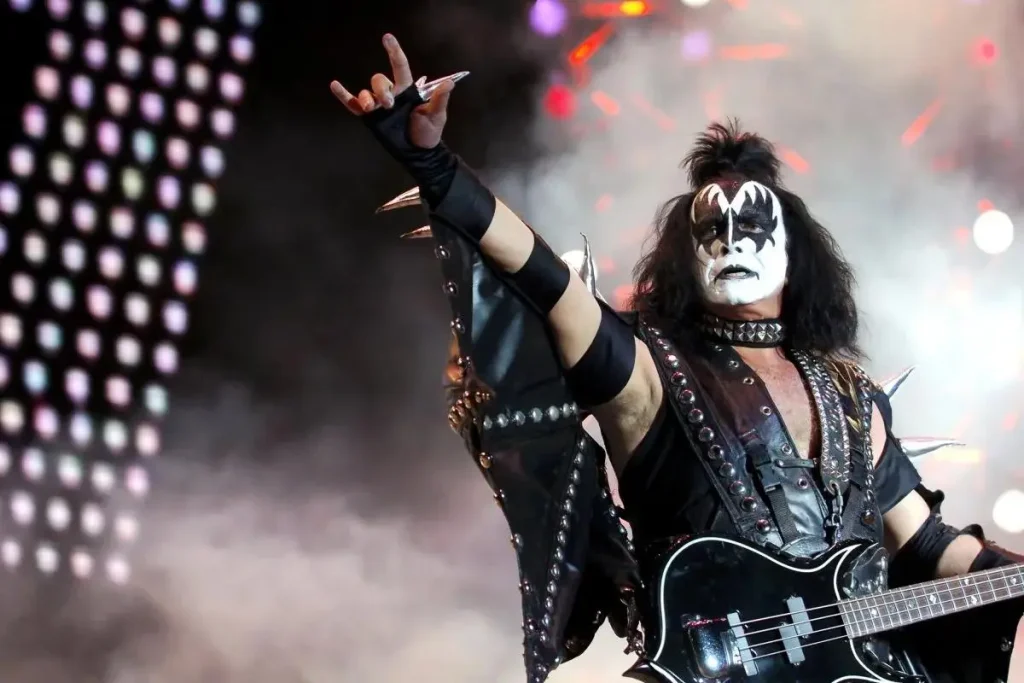 Gene Simmons vs the Devil Horns: When Rock’s Favorite Hand Sign Met the Trademark Office Gene Simmons onstage in his iconic KISS “Demon” makeup and black, spiked armor costume.