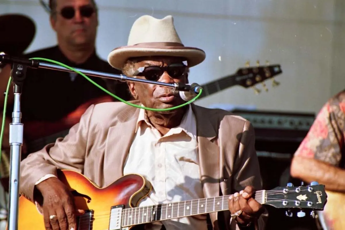 John Lee Hooker performing live while seated.