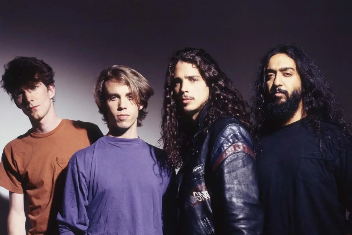 Soundgarden posed in a studio portrait with dramatic lighting.