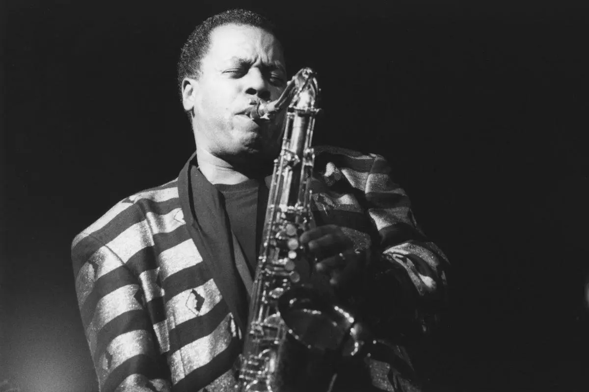 Wayne Shorter playing tenor saxophone onstage.