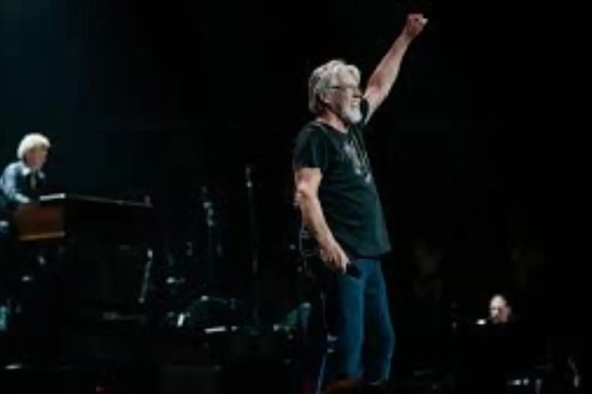 Bob Seger standing onstage during a concert.