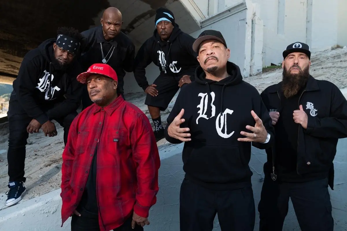 Body Count posing under a concrete overpass, wearing black streetwear and hoodies.
