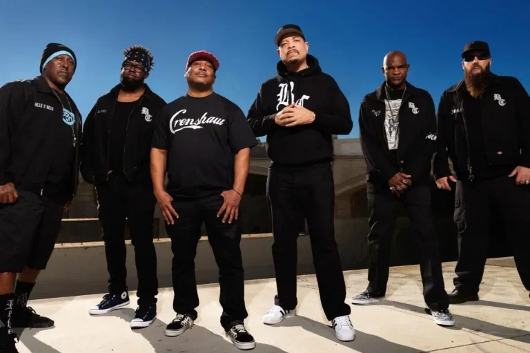 Body Count standing in a line outdoors under a bright blue sky.