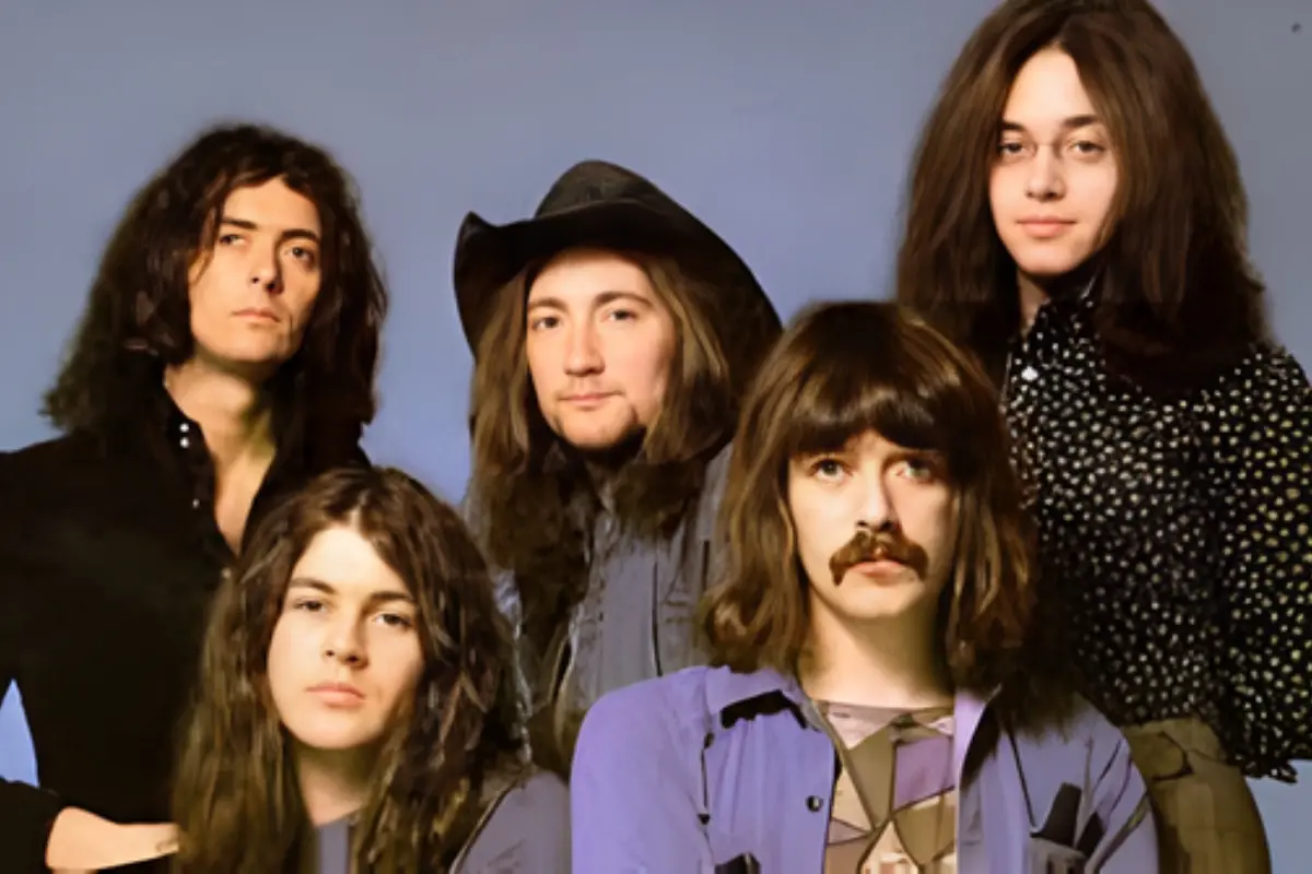 Deep Purple posing for a studio portrait, reflecting the long-haired, late-1960s rock aesthetic associated with early hard rock music.