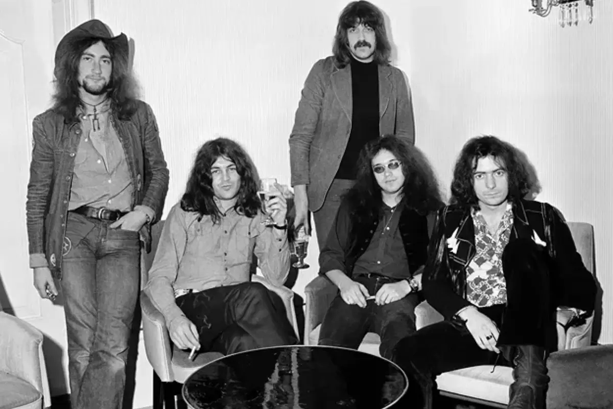 Deep Purple band relaxing indoors, capturing a candid, behind-the-scenes moment from a classic rock era.