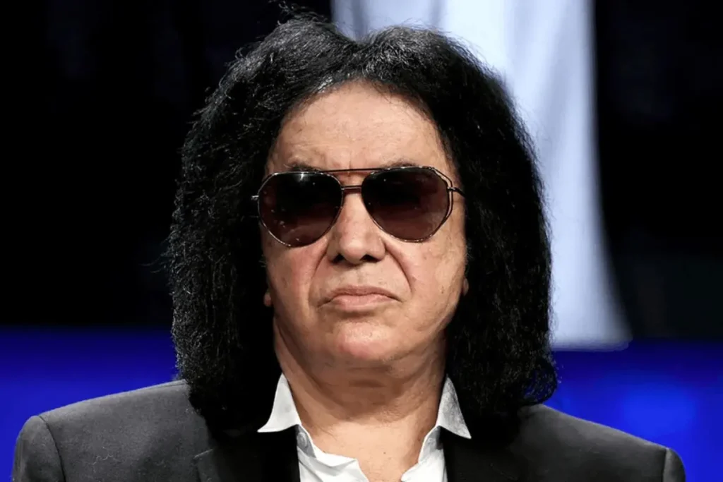 Gene Simmons Stayed Sober in Rock’s Wildest Era – Because His Mom Survived Hell Gene Simmons in a portrait-style image wearing sunglasses and a dark suit, without stage makeup.