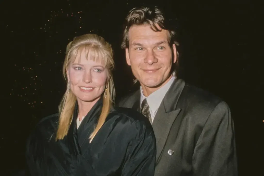 Patrick Swayze and Lisa Niemi standing side by side at a formal event.