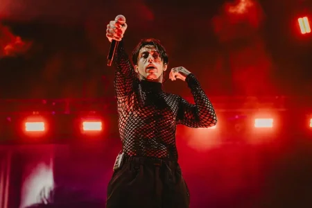 Ronnie Radke on stage wearing a black mesh top.