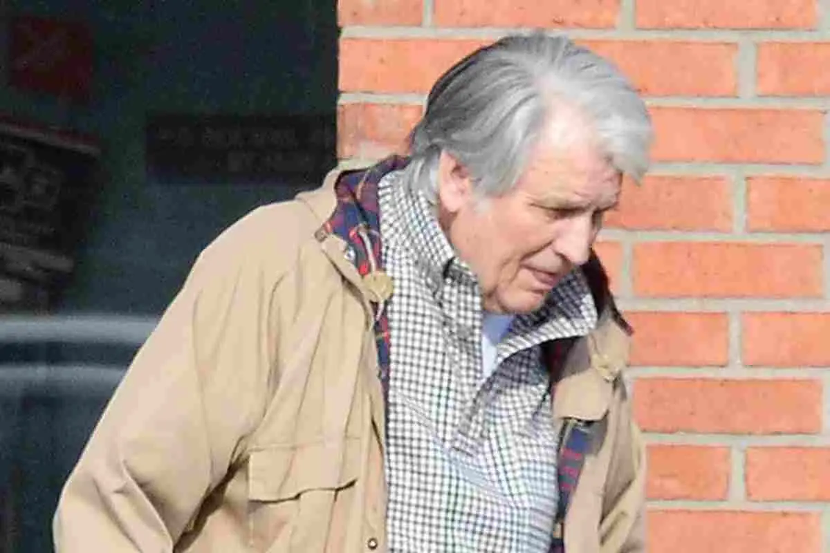 Carl Dean performing live on stage with electric guitar.