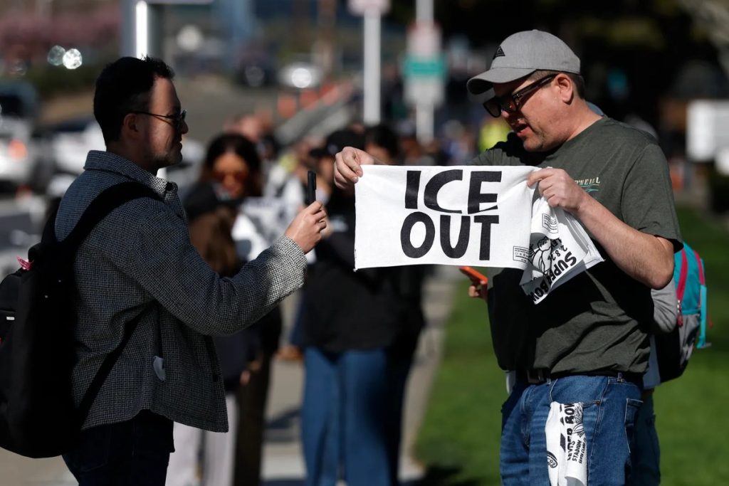 Tom Morello, Jello Biafra and Fishbone Join 47-Track Anti-ICE Benefit Album Contra-ICE Vol. 1: ICE OUT Volunteers hand out ICE OUT rally towels to fans outside Levi's Stadium before Super Bowl LX