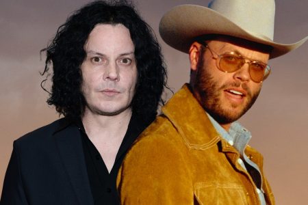 Jack White vs. Charley Crockett: How the Twin Temple Row Turned Into a Public Feud Jack White in a black suit alongside Charley Crockett in a tan cowboy hat and suede jacket