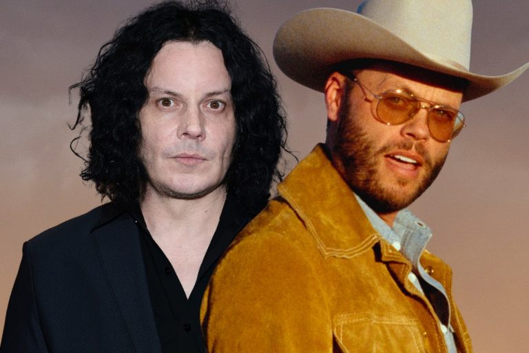 Jack White in a black suit alongside Charley Crockett in a tan cowboy hat and suede jacket