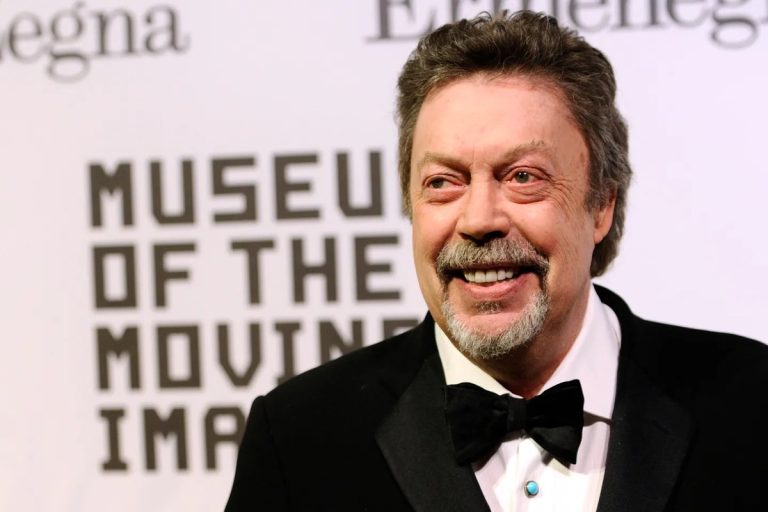 Tim Curry Dies at 80: The Three Rock Albums Behind the Rocky Horror Legend Tim Curry smiling in a tuxedo and bow tie at a Museum of the Moving Image event