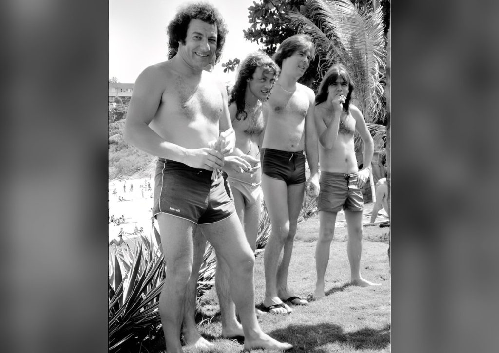 Tourists by Day, Monsters by Night: AC/DC at Ipanema Before Rock in Rio 1985 AC/DC band members shirtless on Ipanema Beach in January 1985