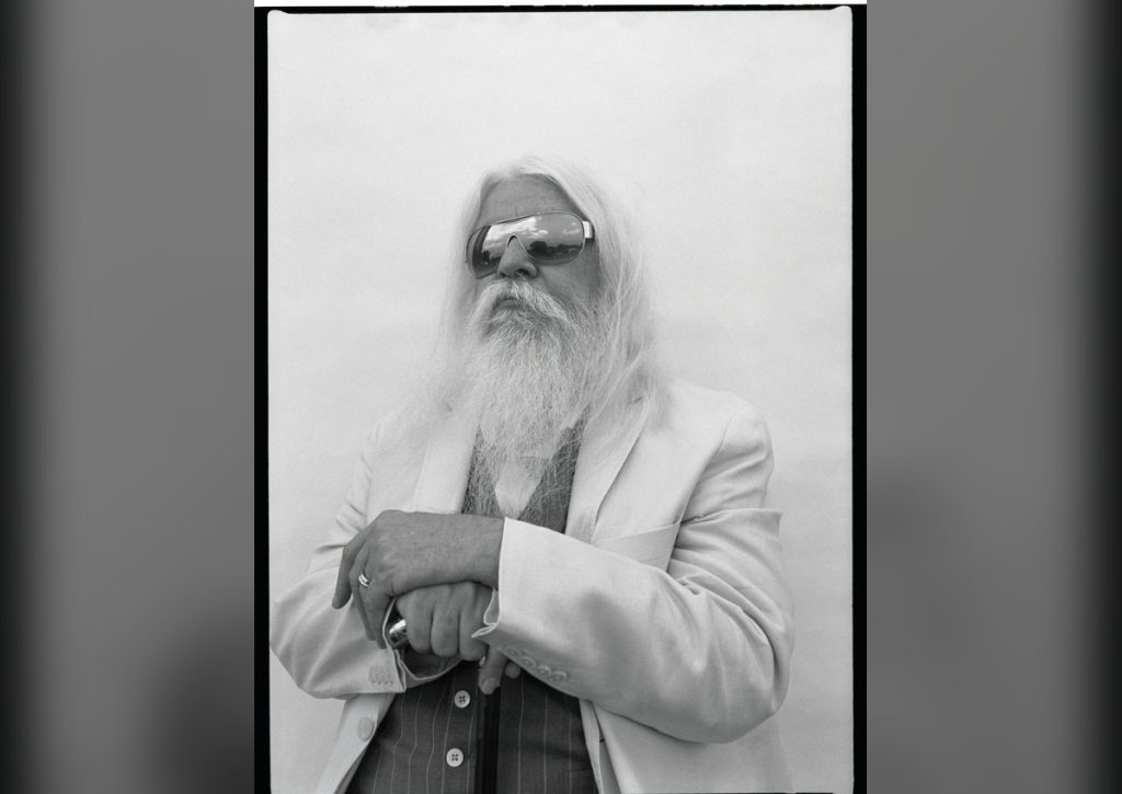 Leon Russell Played on Records You Know by Heart — and Was Credited on Almost None Leon Russell portrait with long white hair and top hat