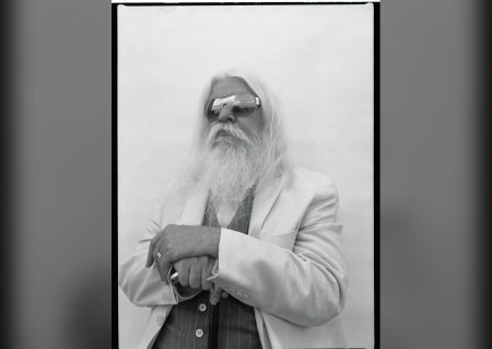 Leon Russell portrait with long white hair and top hat