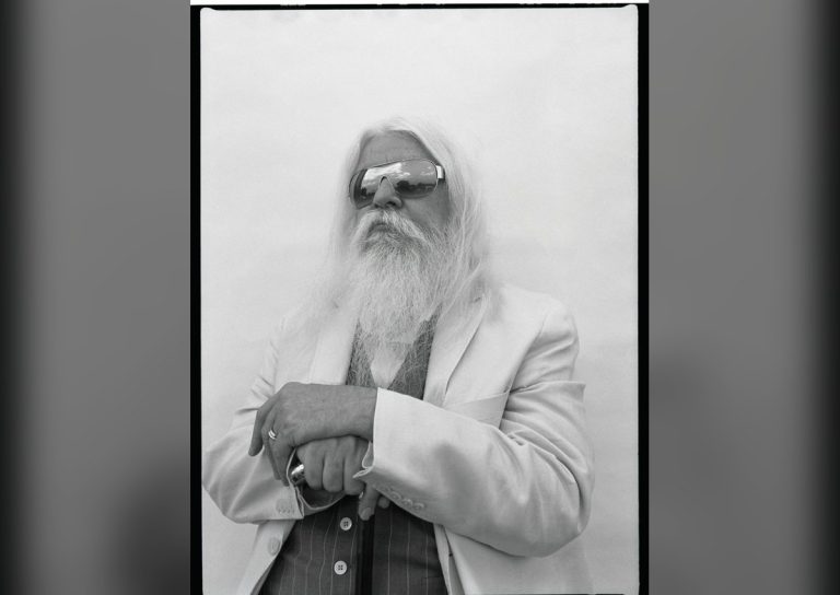 Leon Russell portrait with long white hair and top hat