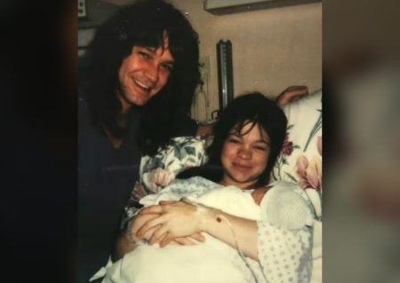 Eddie Van Halen smiling with Valerie Bertinelli and their newborn son Wolfgang at home in 1991