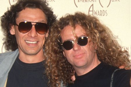 Sammy Hagar Challenges Alex Van Halen to ‘Come Clean’ After ‘Complete Idiot’ Insult Alex Van Halen and Sammy Hagar pose together in sunglasses at an American Music Awards event in the 1990s