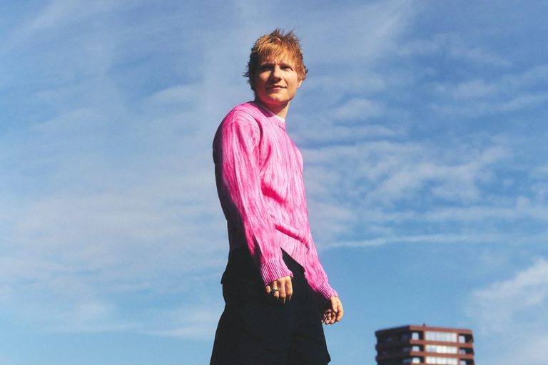 Ed Sheeran Is Out of Support Acts: Finneas, Lukas Graham, Aaron Rowe and Beoga All Quit the Loop Tour Ed Sheeran in a bright pink sweater photographed outdoors against a blue sky