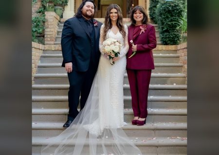 Wolfgang Van Halen with bride Andraia Allsop and mother Valerie Bertinelli on the church steps at his wedding
