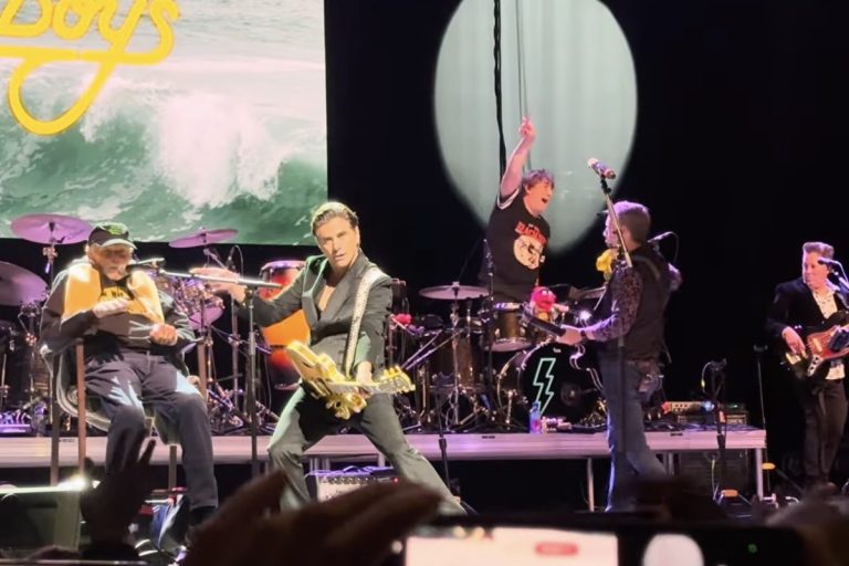 Beach Boys Pulled From Disney’s EPCOT Concerts as John Stamos Takes Their Dates Mike Love seated on stage as John Stamos plays guitar with the Beach Boys in Cincinnati, October 2026